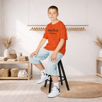 Kids Tee — "Born First. Still in Charge." Sibling Shirt