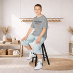 Kids Tee — "Born First. Still in Charge." Sibling Shirt