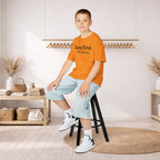 Kids Tee — "Born First. Still in Charge." Sibling Shirt